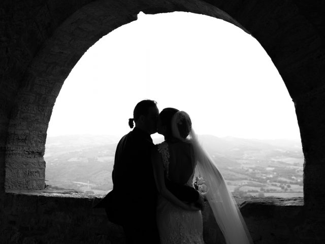 The newlyweds kiss in Todi