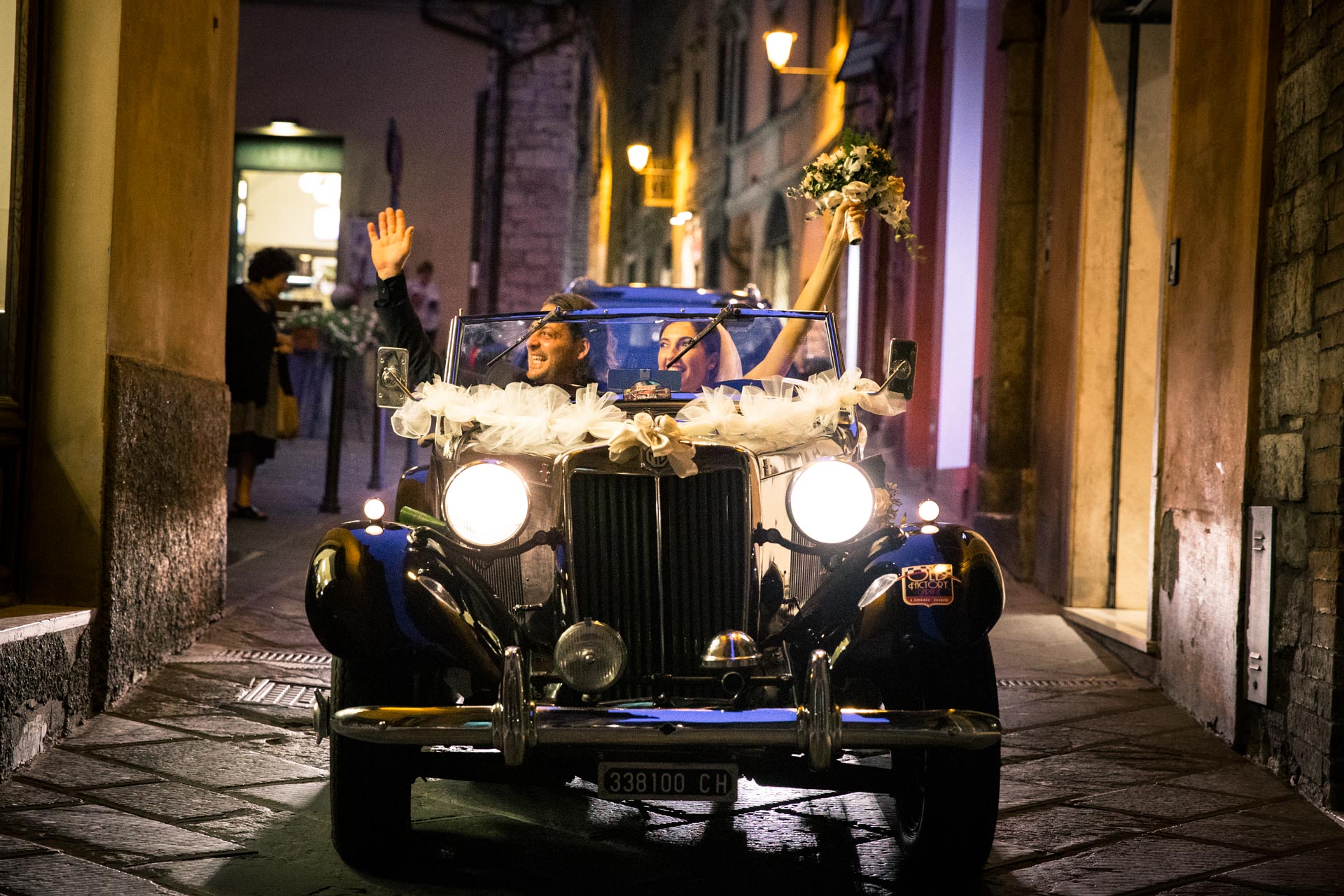 Wedding couple in a vintage car