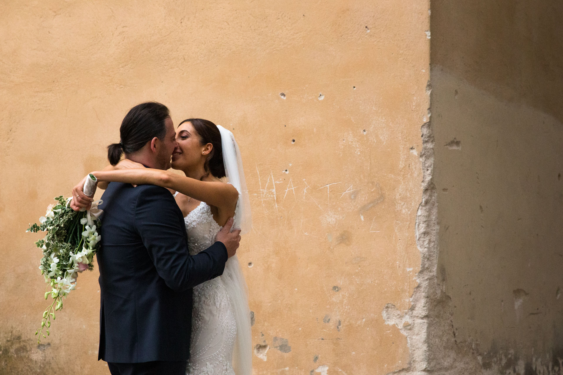 The bride and groom kiss in todi