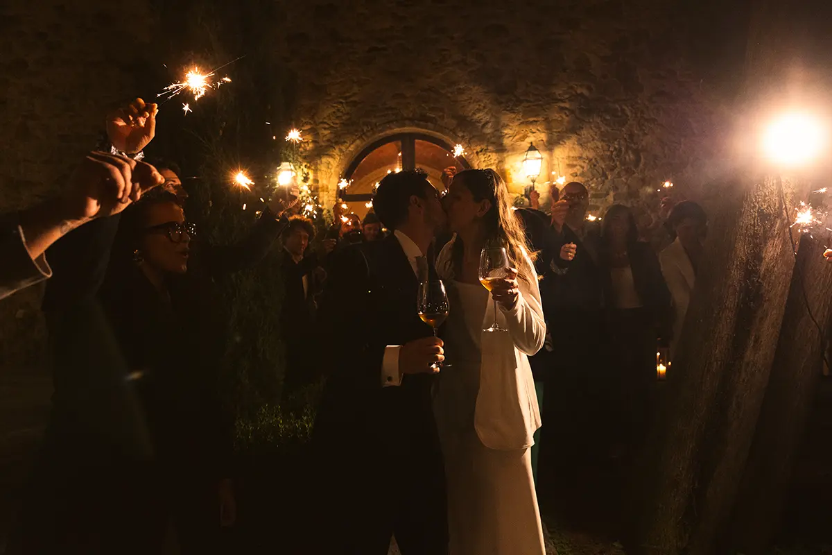 Newlyweds kiss surrounded by sparks