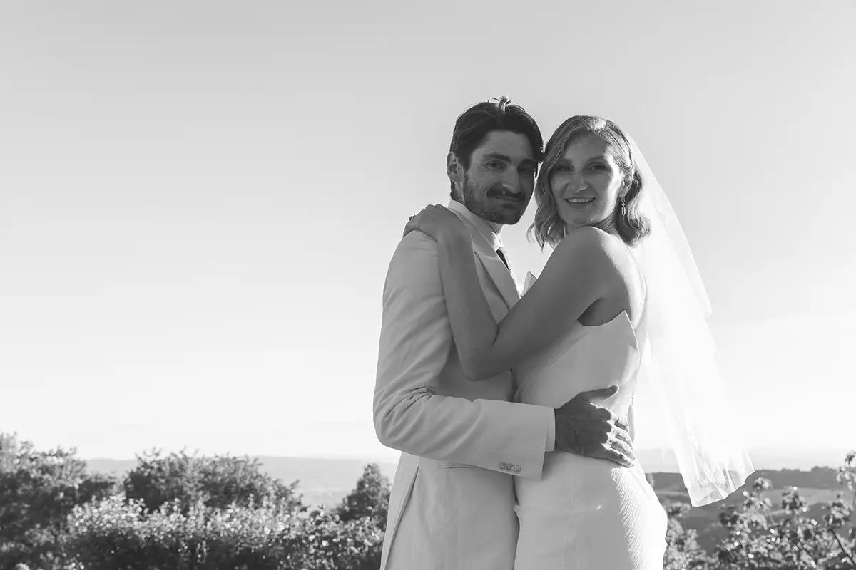 Spouses embrace each other