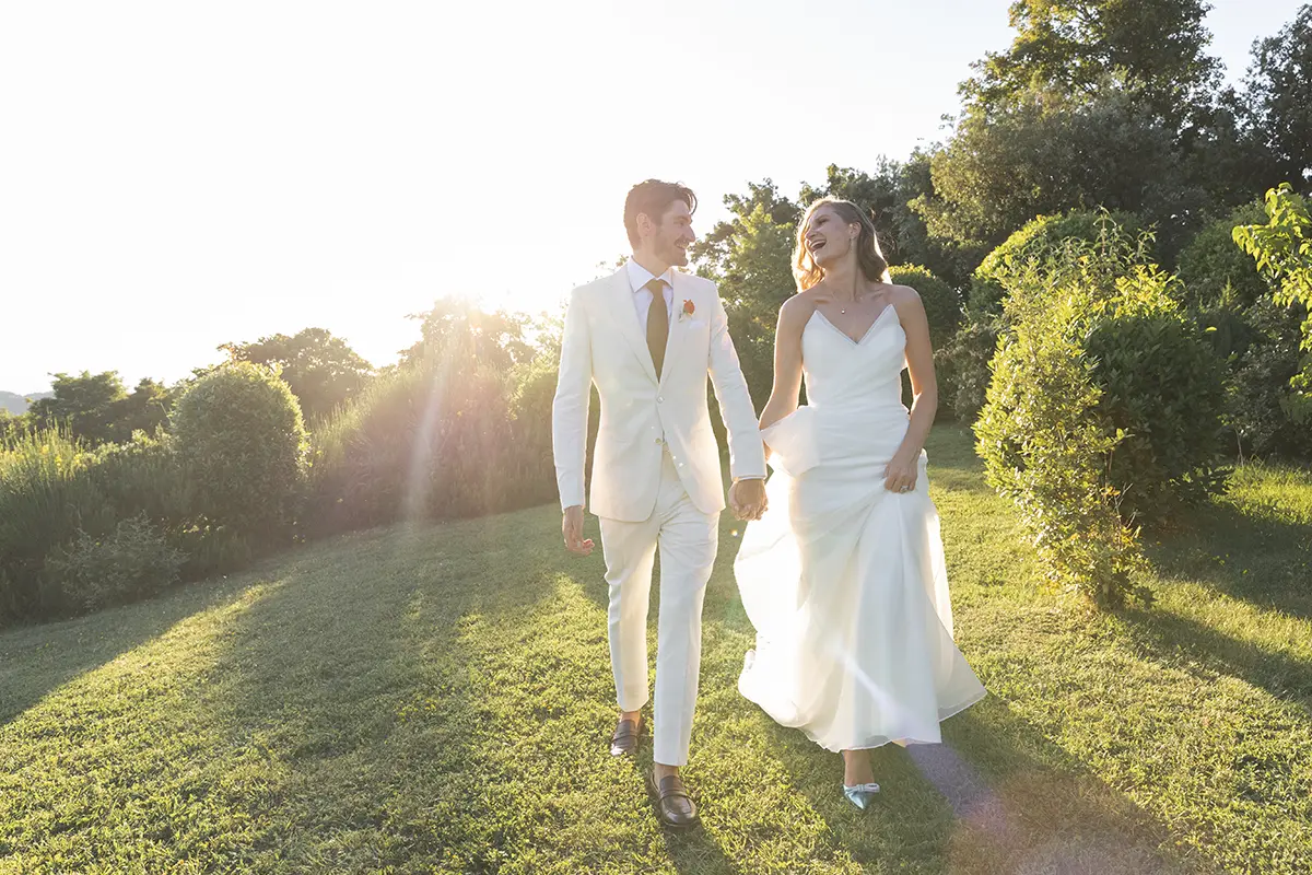 Newlyweds walking in the garden of Petrata Castle