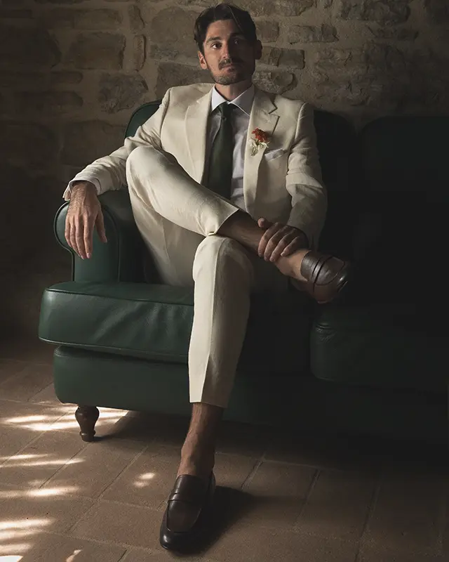 The groom relaxes on a sofa